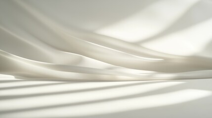 Fototapeta premium Elegant abstract background with flowing white fabric and soft shadows creating a serene and minimalist atmosphere