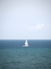 Fototapeta premium boat, sea, sailing, sailboat, yacht, sail, ocean, water, ship, summer, sky, wind, travel, horizon, yachting, nautical, vacation, vessel, sails, recreation, nature, sport, blue, waves, leisure