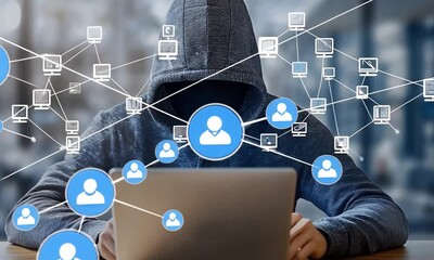 A hooded figure is working on a laptop with a network of connected people icons in front of them. The image is a metaphor for online privacy and security. - Powered by Adobe