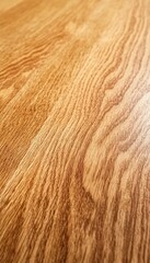 Fototapeta premium Close-up of a smooth, light brown wood grain surface.