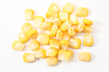 Pile of fresh corn kernels on white background, flat lay