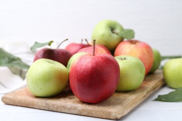 Fresh ripe apples on white table, closeup