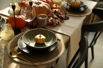 Stylish table setting with beautiful autumn decor in dining room