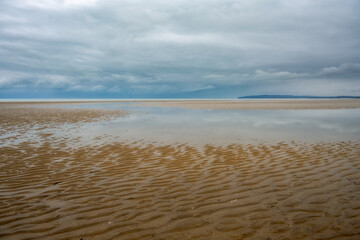 Cumber Sands on an autumn day, view of the beach and the English Channel, East Sussex, England