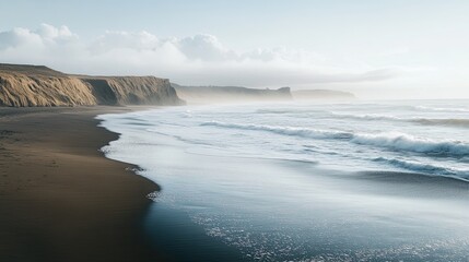 Calm waves crashing on a sandy beach, setting a serene summer atmosphere.
