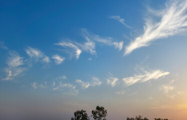 sunset in the mountains, blue sky with clouds pattern, nature photography, natural daylight background 