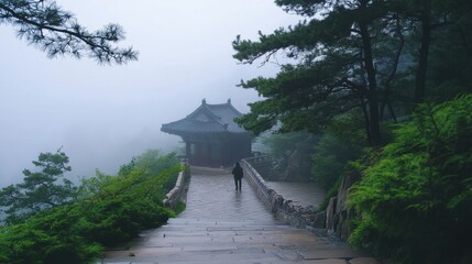 Fototapeta premium Misty Mountain Temple: A Tranquil Journey through Nature's Embrace