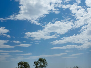 blue sky with clouds pattern, nature photography, natural daylight background 