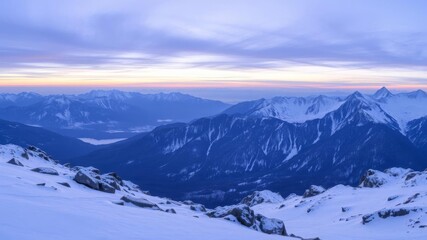 Majestic mountain range covered in snow under a clear blue sky, remote, tranquil