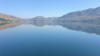 Tranquil lake surrounded by lush green trees reflecting in the water, nature, outdoors