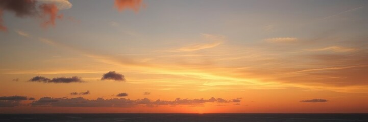 Fototapeta premium Vibrant sunrise over a calm sea with colorful sky reflecting on the water, horizon, reflection