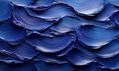 Abstract blue texture resembling flowing waves, showcasing depth and movement in paint.