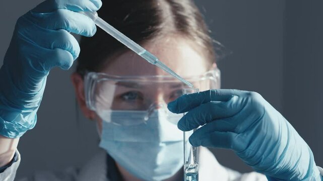 Pharmaceft in the chemical laboratory is working on development new drugs for treatment and medical industry. A scientist sets up experiment in new study. Vaccine testing. Biotechnology and analysis