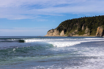 Rocks of Stolbchaty. landscape with columnar basalt lavas rocks forming a natural geometric pattern. Geographic cape on the east shore of Kunashir Island of Sakhalin Oblast, Russia. Mendeleyev volcano