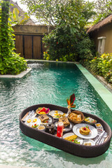 Floating breakfast in a swimming pool