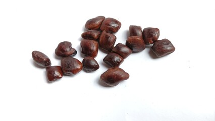 Tamarind seeds isolated on white background.top view ,flat lay.