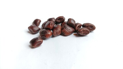 Dried tamarind seeds isolated on a white background