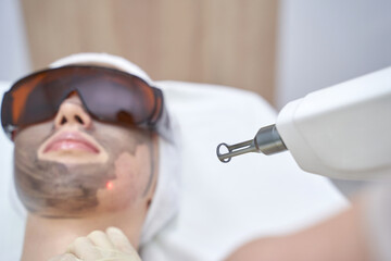Advanced laser skin treatment in professional clinic for rejuvenation and clear complexion with...