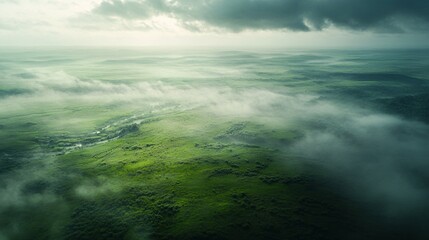 Fototapeta premium Aerial View of Misty Green Valley