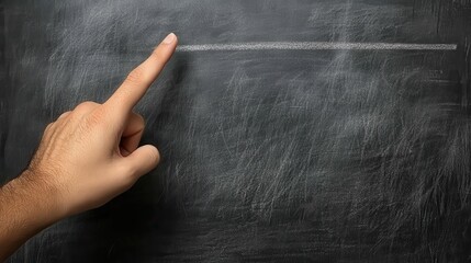 Hand Pointing at Blank Chalkboard in Classroom Setting