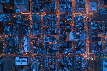 Aerial night view of urban metropolis illuminated by city lights
