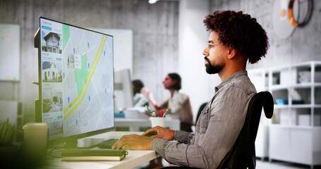 African Man Using Laptop To Search Online Real Estate Property Listings