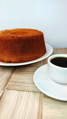 Brazilian cake and cup of coffee on the rustic table.	
