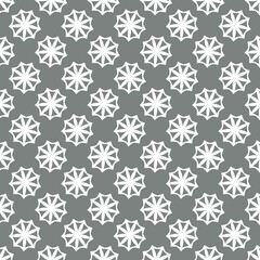 Seamless Geometric Floral Pattern with Starburst Design in Monochrome Gray and White for Wallpaper or Textile. Illustration