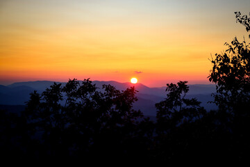 sunset in the mountains with layers of color