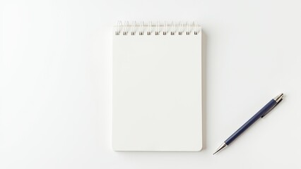 Spiral-bound notebook with blank pages alongside a beige pen, isolated on a white background. Everyday things for writing and note-taking.