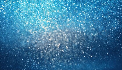 Obraz premium Blue Sparkling Texture of Glitter Particles in Soft Focus. Abstract Background for Winter, Festive, or Cosmic Themed Designs, Ideal for Website Banners, Invitations, or Seasonal Graphics