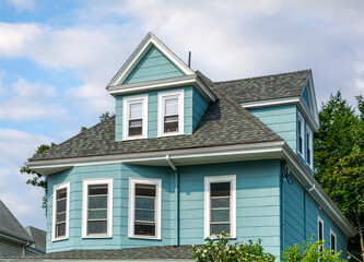 Upper Story of a Classic Home with Dormer and Bay Windows in Brighton, Massachusetts, USA