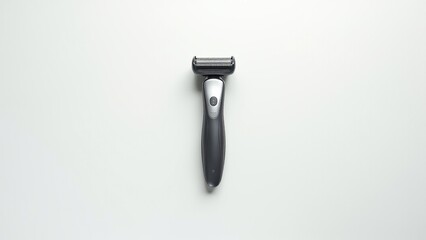 Obraz premium Minimalist electric shaver on a plain background, showcasing everyday things in a clean, modern design.