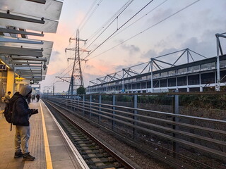 London - 03.08.2024: Passengers waiting for a train at the Custom House Elizabeth Line station...