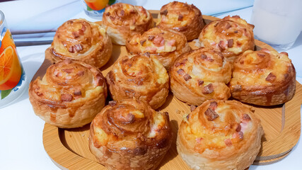 Puff pastry buns baked with sausage and cheese