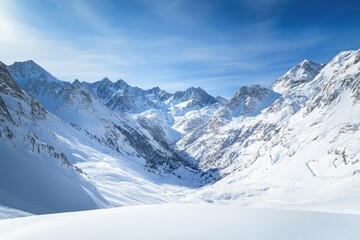Obraz premium A sweeping view of snow-covered mountains under a bright blue sky, with subtle shadows and highlights emphasizing the cool, serene beauty of winter.