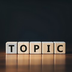 Obraz premium Word TOPIC spelled out using wooden blocks, concept of communication, discussion, knowledge sharing, and content creation on reflective wooden floor background