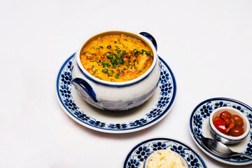 hot cassava broth, traditional homemade soup from Minas Gerais, Brazil, served hot with parsley and other vegetables