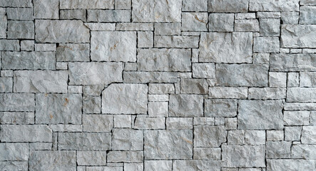 Gray natural stone wall background texture