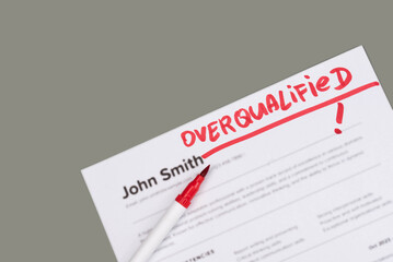Obraz premium Fake mock CV (curriculum vitae) for John Smith, rejected by HR as not the right Overqualified candidate. Concept of job search, hiring mismatch, recruitment process, and rejection. 