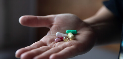 pharmaceuticals.medicines close-up, pills on the palm