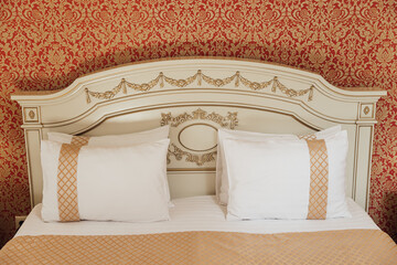 minimal double bed with white mattress in luxury hotel bedroom