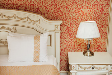 minimal double bed with white mattress in luxury hotel bedroom