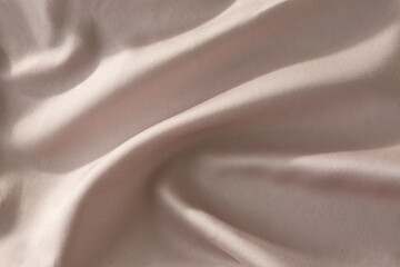 Closeup image of silky pink fabric