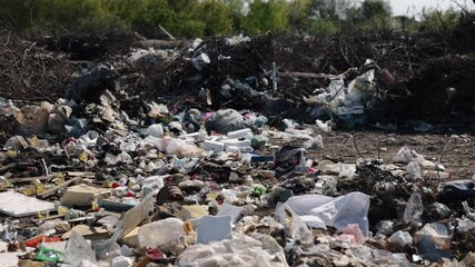 Land pollution, Trash zone, Waste crisis. Waste mounds overtaking landscapes underscore critical environmental crisis, necessitating immediate changes waste management practices.