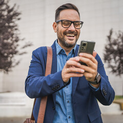 Welcoming businessman have video call or self portrait outdoor