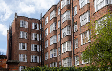 Fototapeta premium Touristic route on Notting Hill, walking on streets with colourful houses, Portobello road, city life, wealthy neighbourhoods in London, UK