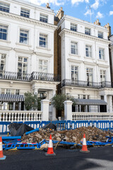 Sewer or cabling repairs works in Notting Hill, city life in wealthy neighbourhoods in London, Uk