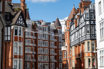 Red bricks houses on Hans Crescent street in Royal Borough of Kensington and Chelsea, London, UK