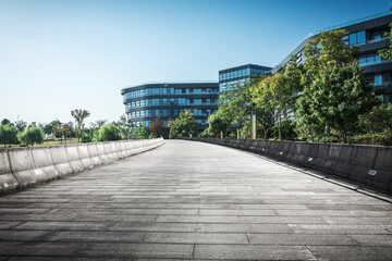 Serene Urban Walkway Highlighting Modern Architecture and Nature